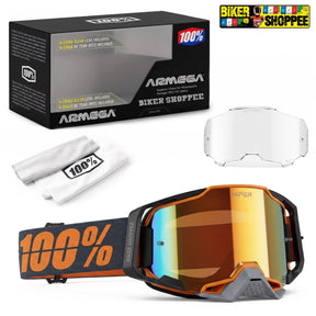 ARMEGA Biker Shoppee snow goggles with a reflective orange, yellow, and blue mirrored lens, shown alongside its black retail box, a white lens, a white microfiber cloth, and a Biker Shoppee logo sticker.