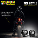 A person wearing a black hoodie and helmet sits on a motorcycle facing away from the camera, with two black bike light products shown in the lower right. The scene is dark with promotional text reading 'RIDE IN STYLE', 'SLEEK FLASHING LIGHT', and 'ENHANCE YOUR BIKE WITH A SHARP FLASHING LIGHT'.