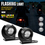 Two black LED motorcycle headlight beams shown in the foreground on a white diagonal section, with a nighttime road scene of motorcyclists in the background. Large text reads 'FLASHING LIGHT FOR MOTORCYCLES BUILT FOR NIGHT' and 'DC12V'.