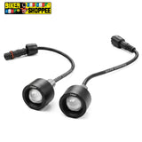 Two small black motorcycle or bicycle headlight bulbs with attached black cables and connectors, shown on a white background. The brand name 'BIKER SHOPPEE' is printed on the cable and also appears in the top-left corner logo.