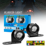 Two RED LIU HJG Biker Shoppee blinker light motorcycle headlight units shown in front of their blue retail box, with a blurred background of motorcycles on a road at night and the text 'BLINKER LIGHT'. STROBE LIGTH