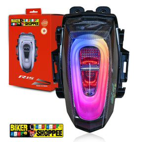 Motorcycle tail light with colorful design next to its packaging on a white background