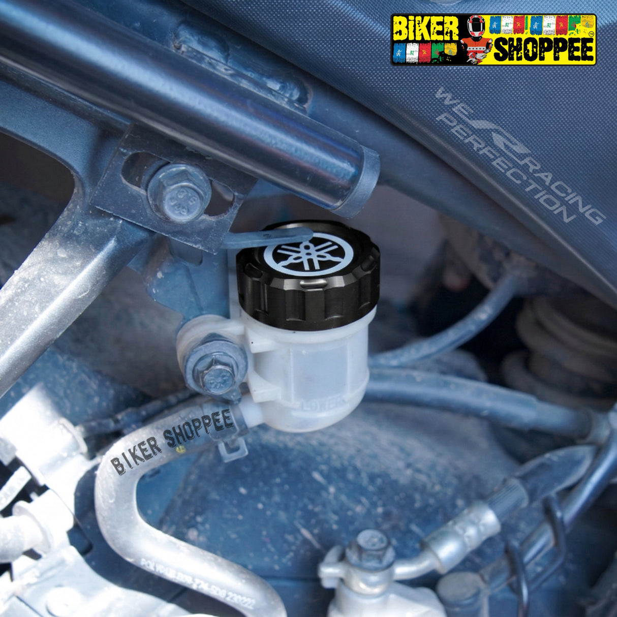 Close-up of a motorcycle brake fluid reservoir with Yamaha logo, branded 'Biker Shoppee'.